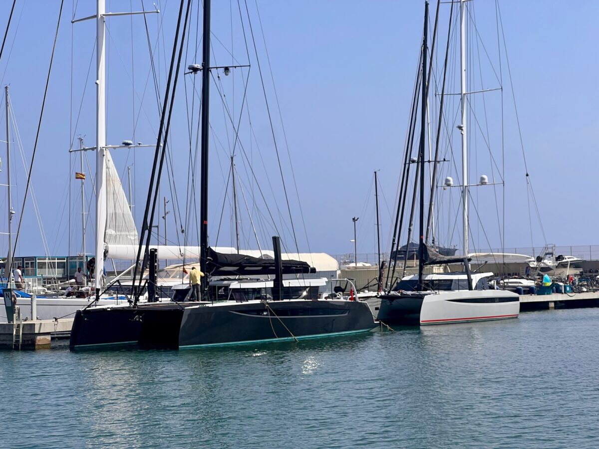 The HH60 catamaran moored alingside the dock with the HH44 behind her